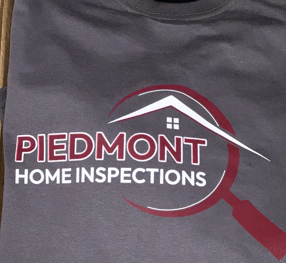 Screen printed full-front logo on a charcoal tee